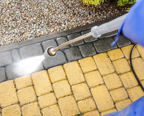 Side view of bricks being powerwashed