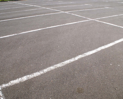 Close up view of old parking lot stripes