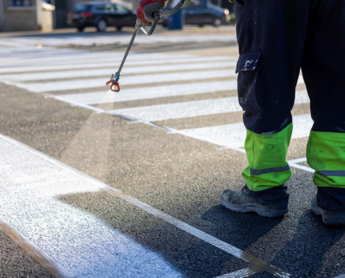 Process of making new road surface markings with a line striping machine